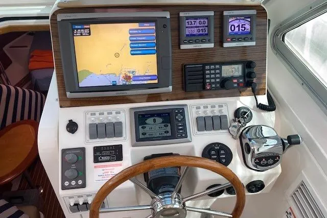 Slide: The Image of Helm of 2013 Back Cove 34 boat with navigation and control instruments. - 6