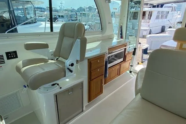 Slide: The Image of Interior of a 2013 Back Cove 34 yacht with seating and cabinetry. - 7