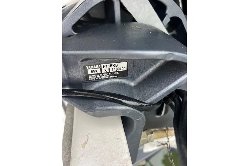 Slide: The Image of Close-up of Yamaha F115XB engine label on 2023 Novurania Como 18 boat. - 14