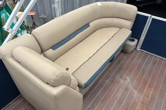 Slide: The Image of Beige seating on 2019 Sweetwater 2286 boat with wooden deck and cup holder. - 14