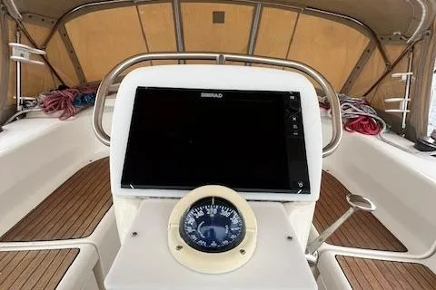 Slide: The Image of Cockpit of 2000 Bavaria 42 Cruiser sailboat with navigation instruments and compass. - 14