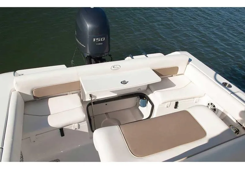 Slide: The Image of Manufacturer Provided Image: 2014 Sportsman Heritage 211 Center Console boat interior with seating and Yamaha 150 engine. - 23