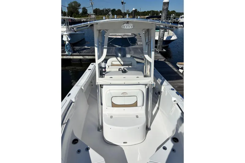 Slide: The Image of 2014 Sportsman Heritage 211 Center Console boat docked at marina. - 6