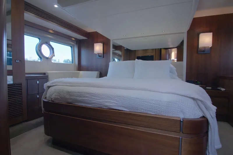 Slide: The Image of Luxurious bedroom interior of 2014 Sunseeker Manhattan 55 yacht with elegant wood finishes. - 14