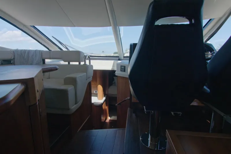 Slide: The Image of Interior view of 2014 Sunseeker Manhattan 55 yacht, featuring modern seating and helm. - 19