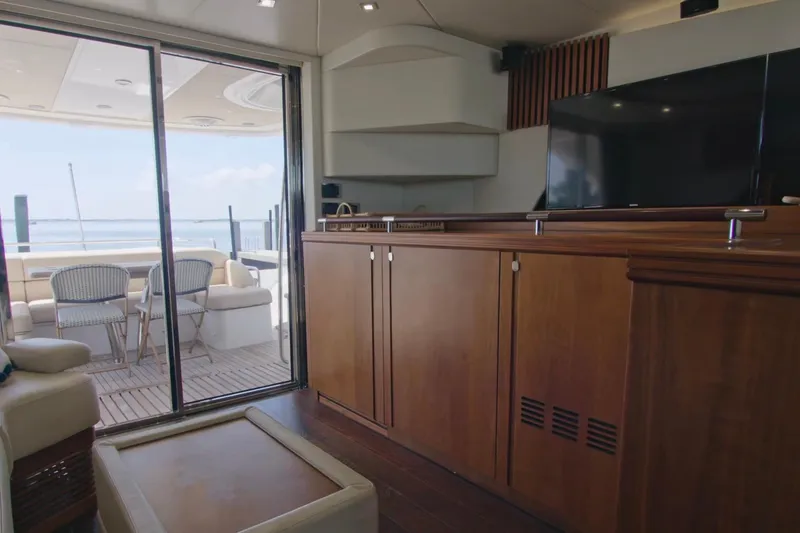 Slide: The Image of Interior of 2014 Sunseeker Manhattan 55 yacht with elegant wood cabinetry and outdoor seating. - 25