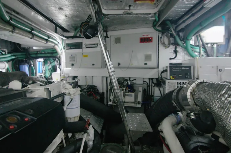 Slide: The Image of Engine room of 2014 Sunseeker Manhattan 55 yacht, featuring complex machinery and wiring. - 26
