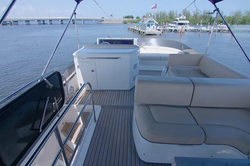 Slide: The Image of Flybridge of 2014 Sunseeker Manhattan 55 yacht with seating and water view. - 3