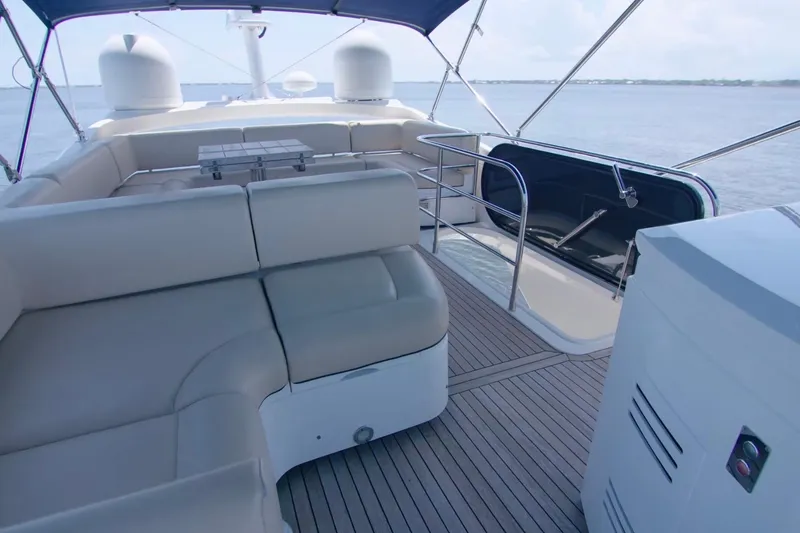 Slide: The Image of Luxurious 2014 Sunseeker Manhattan 55 yacht deck with comfortable seating and ocean view. - 4