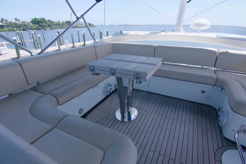 Slide: The Image of Luxurious seating area on 2014 Sunseeker Manhattan 55 yacht with scenic waterfront view. - 5