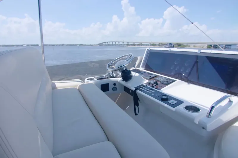 Slide: The Image of Helm of 2014 Sunseeker Manhattan 55 yacht with scenic water view. - 6