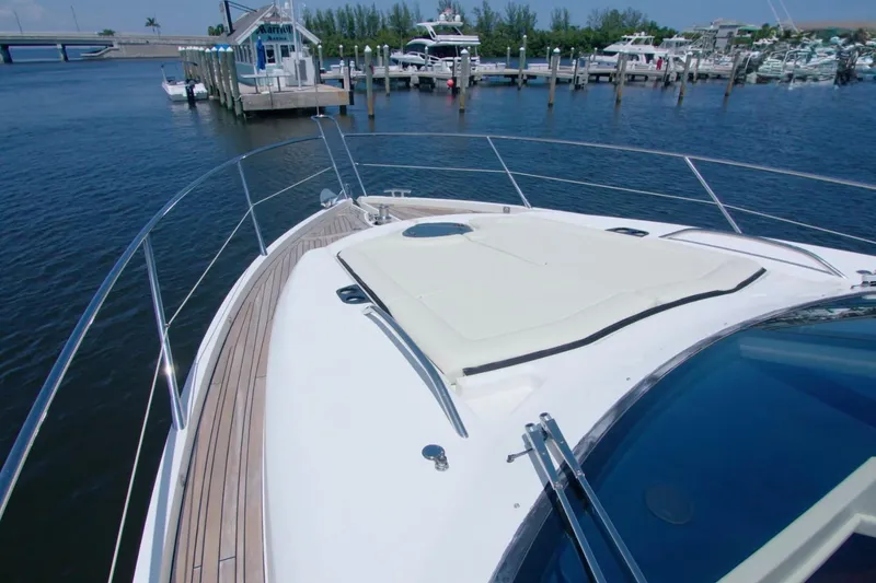 Slide: The Image of Sunseeker Manhattan 55 yacht bow view at marina, 2014 model. - 7