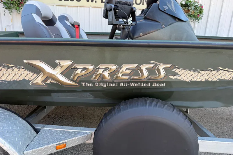 Slide: The Image of 2014 Xpress H18 boat with "The Original All-Welded Boat" logo on the side. - 15