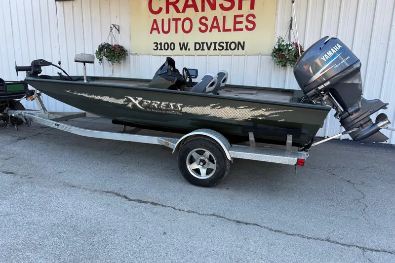Slide: The Image of 2014 Xpress H18 boat with Yamaha motor on trailer at Cransh Auto Sales. - 5