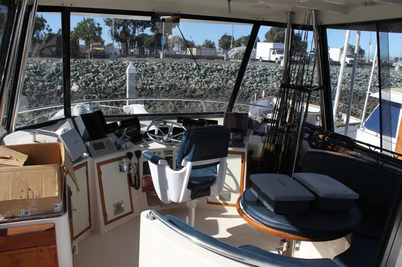 Slide: The Image of Interior view of a 1994 Mikelson 64 yacht cockpit with navigation equipment. - 20