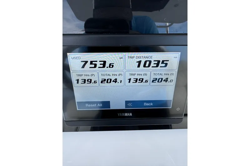 Slide: The Image of Yamaha display showing fuel usage and trip data on 2022 Edgewater 262CC boat. - 12
