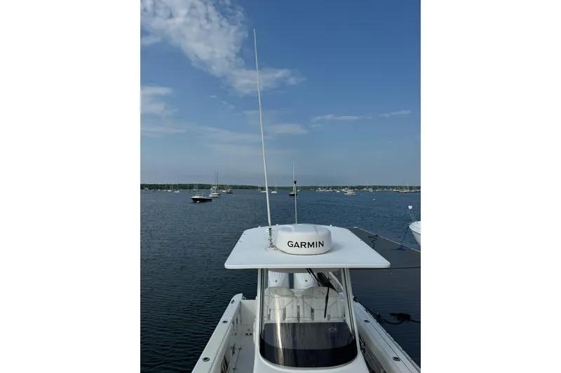 Slide: The Image of Edgewater 262CC 2022 boat with Garmin radar on calm water. - 23