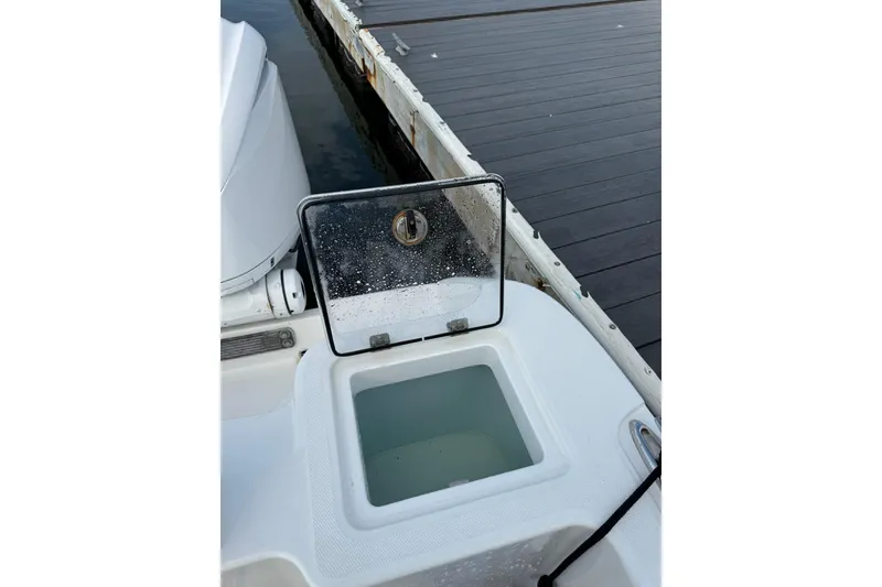 Slide: The Image of Open hatch on 2022 Edgewater 262CC boat, dockside view. - 33