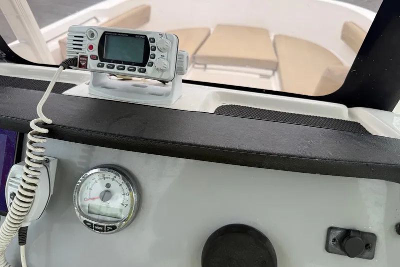 Slide: The Image of Control panel of 2022 Bayliner Trophy T22CX boat with radio and gauge. - 17