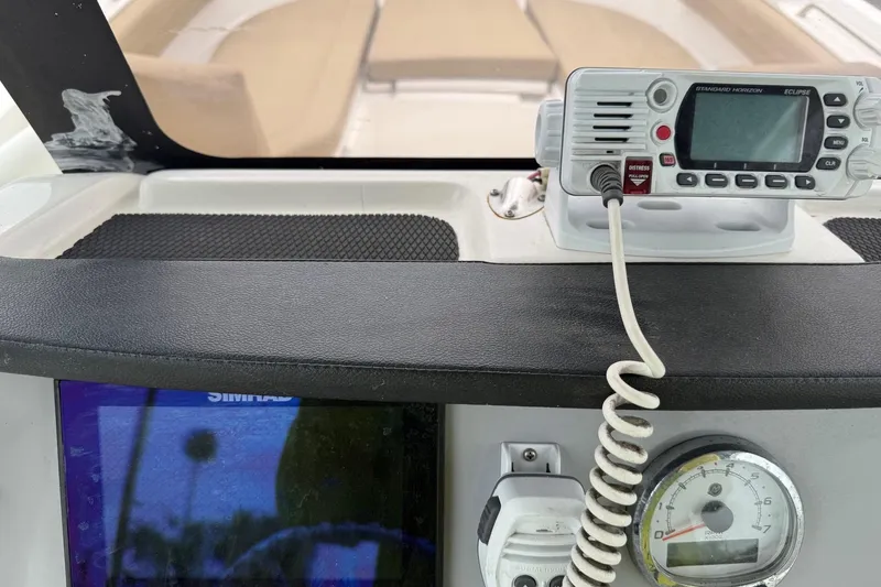 Slide: The Image of 2022 Bayliner Trophy T22CX dashboard with radio, gauge, and navigation display. - 18