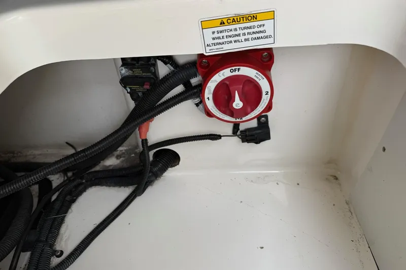 Slide: The Image of Battery switch and wiring inside 2022 Bayliner Trophy T22CX boat compartment. - 8