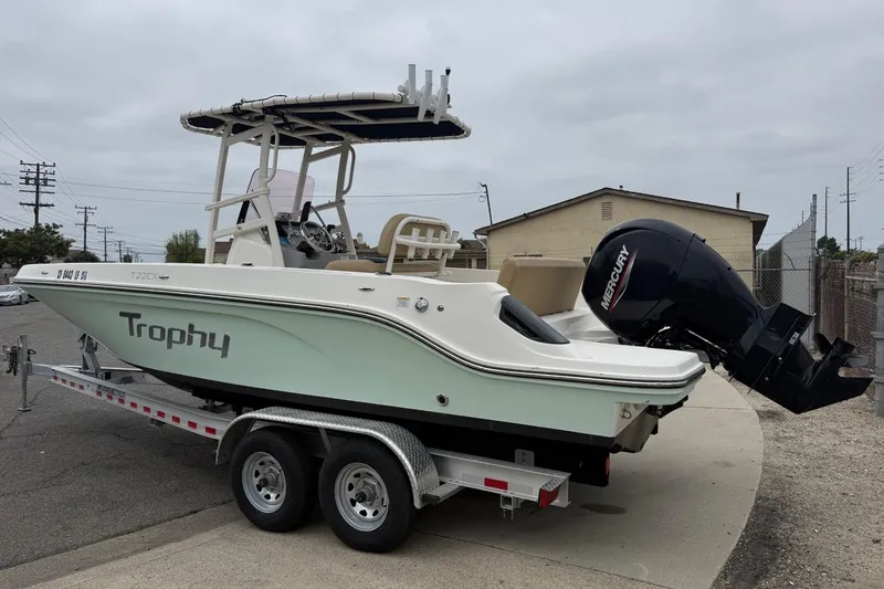 Slide: The Image of 2022 Bayliner Trophy T22CX boat on trailer with Mercury outboard motor. - 9