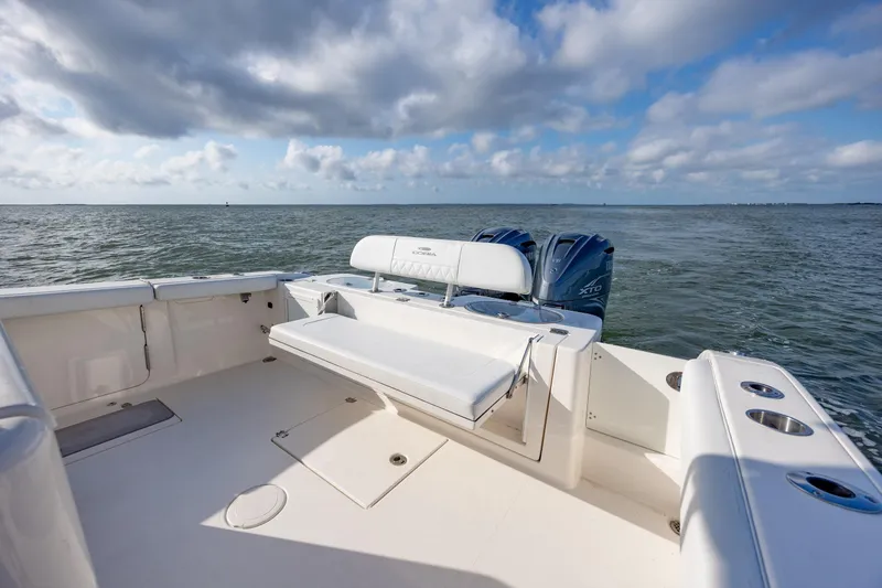 Slide: The Image of 2020 Cobia 350 Center Console boat with dual engines on open water. - 11