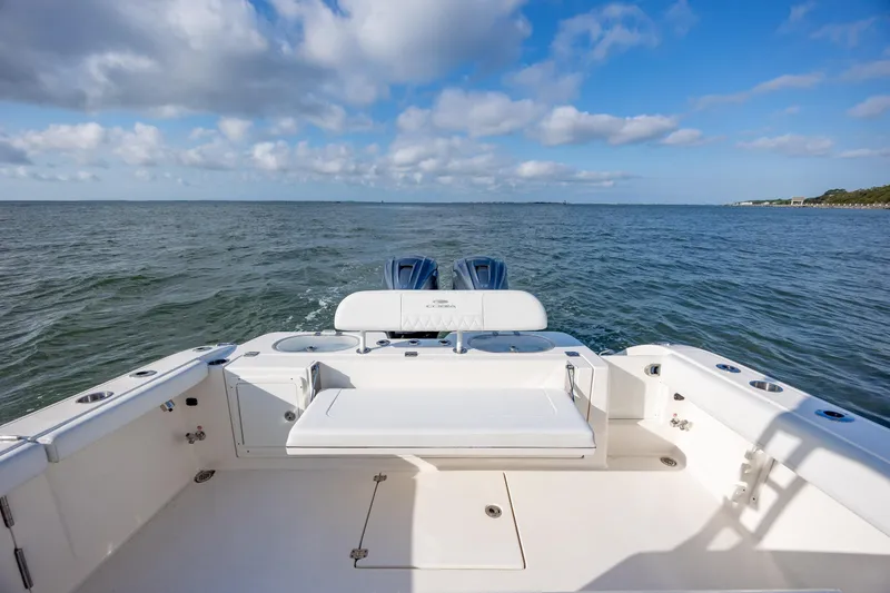 Slide: The Image of 2020 Cobia 350 Center Console boat on open water under blue sky. - 12