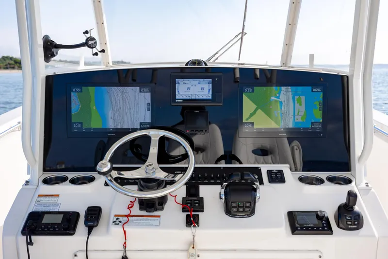 Slide: The Image of 2020 Cobia 350 Center Console dashboard with advanced navigation and control systems. - 16