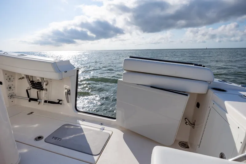 Slide: The Image of 2020 Cobia 350 Center Console boat interior with ocean view and seating area. - 26