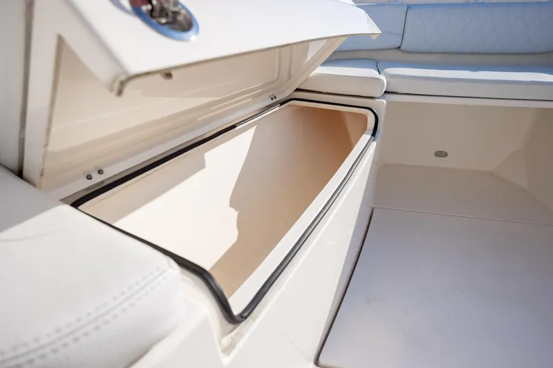 Slide: The Image of Open storage compartment on a 2020 Cobia 350 Center Console boat. - 29