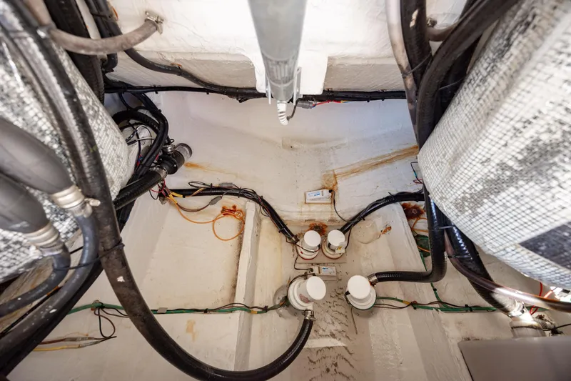 Slide: The Image of Engine compartment of a 2020 Cobia 350 Center Console boat, showcasing wiring and components. - 32