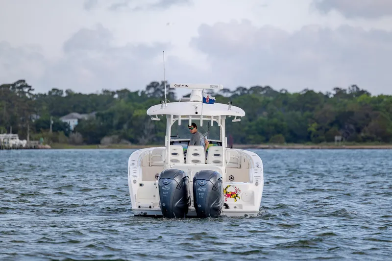 Slide: The Image of 2020 Cobia 350 Center Console boat on water with twin Yamaha 425 engines. - 9