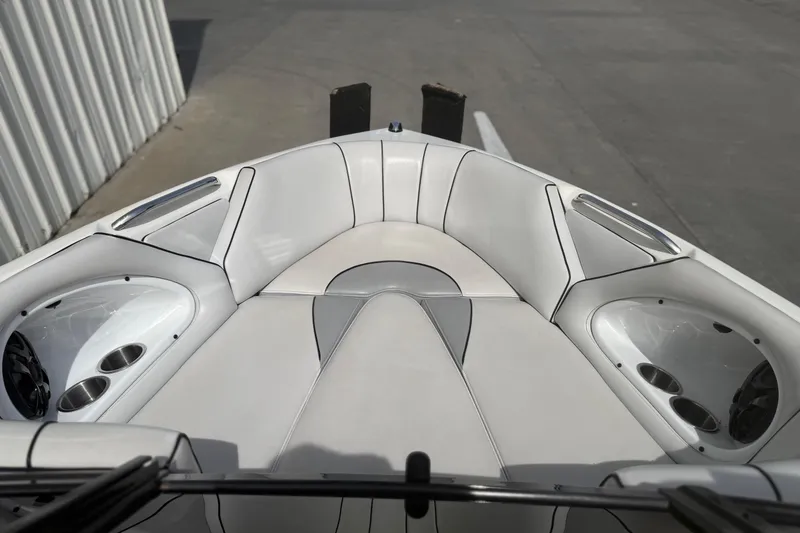 Slide: The Image of 2006 MB SPORTS B52 boat interior with white seating and cup holders. - 11