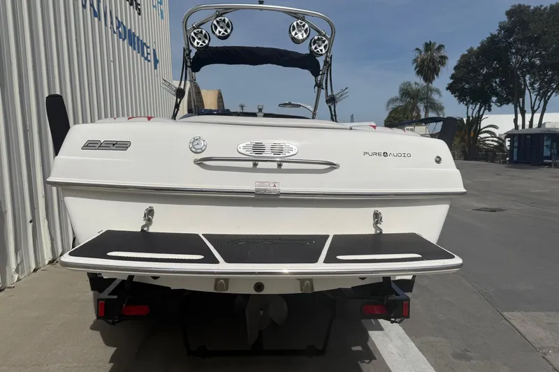 Slide: The Image of 2006 MB SPORTS B52 boat rear view with swim platform and audio system. - 5