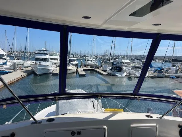 Slide: The Image of View from 1997 Riviera 43 Open Flybridge, overlooking marina with multiple boats docked. - 9