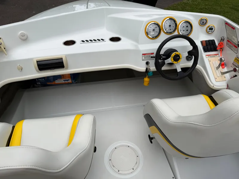Slide: The Image of Interior of a 2003 Baja 20 Outlaw boat with steering and gauges. - 11