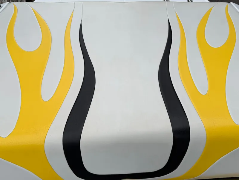 Slide: The Image of 2003 Baja 20 Outlaw with yellow flame design on white background. - 12