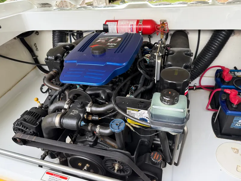 Slide: The Image of Engine compartment of a 2003 Baja 20 Outlaw boat with MerCruiser engine. - 14