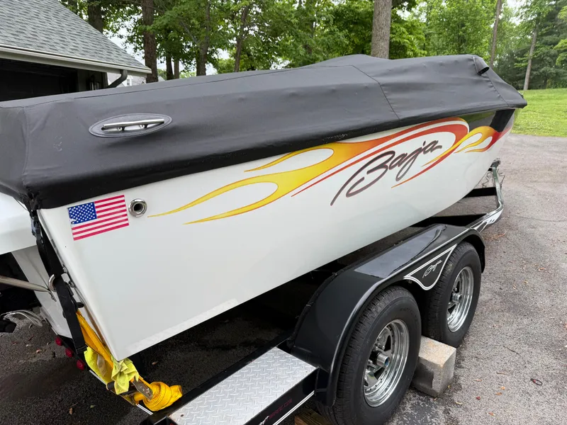 Slide: The Image of 2003 Baja 20 Outlaw boat on trailer with cover. - 8