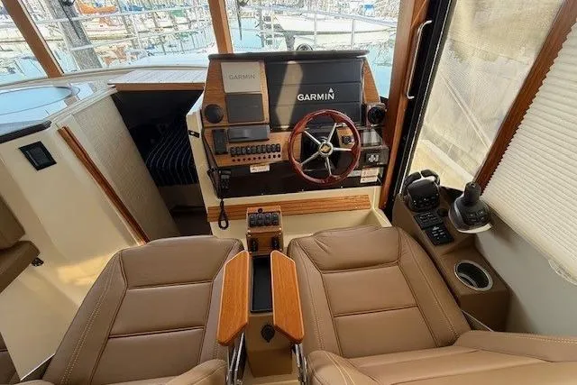Slide: The Image of Interior helm of 2022 Ranger Tugs R-43 CB with Garmin navigation system. - 13