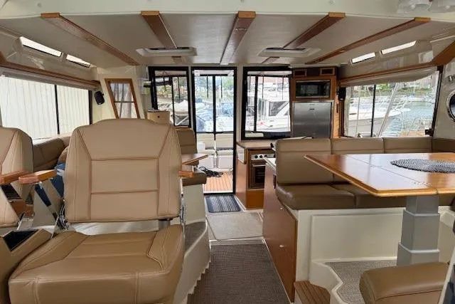 Slide: The Image of Interior of 2022 Ranger Tugs R-43 CB yacht with luxurious seating and dining area. - 17