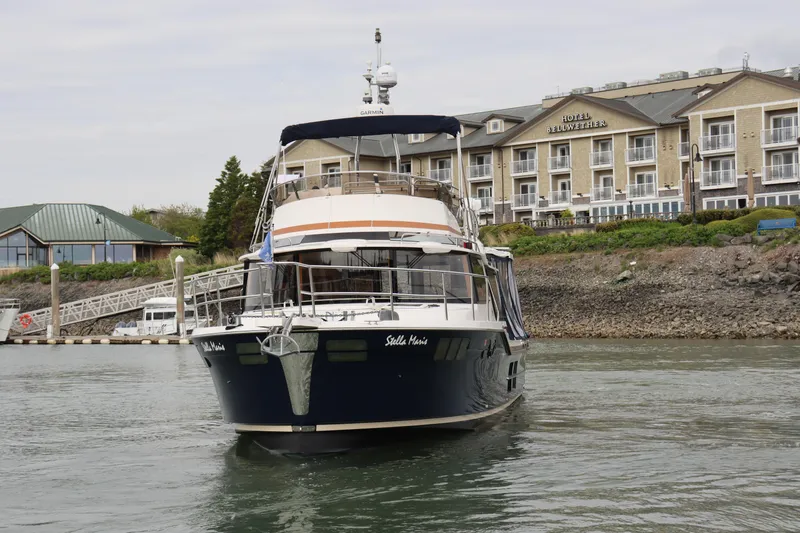 Slide: The Image of 2022 Ranger Tugs R-43 CB yacht docked near Hotel Bellwether. - 2