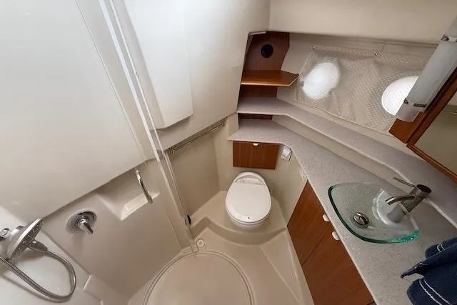 Slide: The Image of 2022 Ranger Tugs R-43 CB bathroom with modern fixtures and compact design. - 23