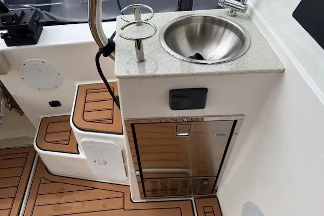 Slide: The Image of 2022 Ranger Tugs R-43 CB boat interior with sink and mini fridge. - 28
