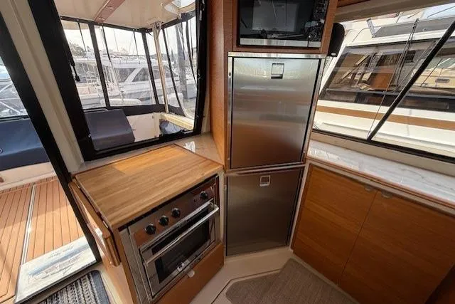Slide: The Image of Interior of 2022 Ranger Tugs R-43 CB yacht with modern kitchen appliances. - 3