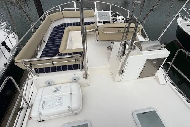 Slide: The Image of Flybridge of 2022 Ranger Tugs R-43 CB with seating and navigation equipment. - 32