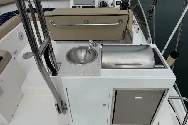 Slide: The Image of 2022 Ranger Tugs R-43 CB yacht deck with sink and grill setup. - 33