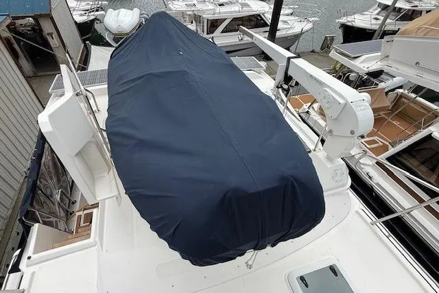 Slide: The Image of 2022 Ranger Tugs R-43 CB yacht with covered deck, docked at marina. - 36