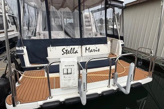 Slide: The Image of 2022 Ranger Tugs R-43 CB yacht "Stella Maris" docked with teak deck and protective covers. - 37
